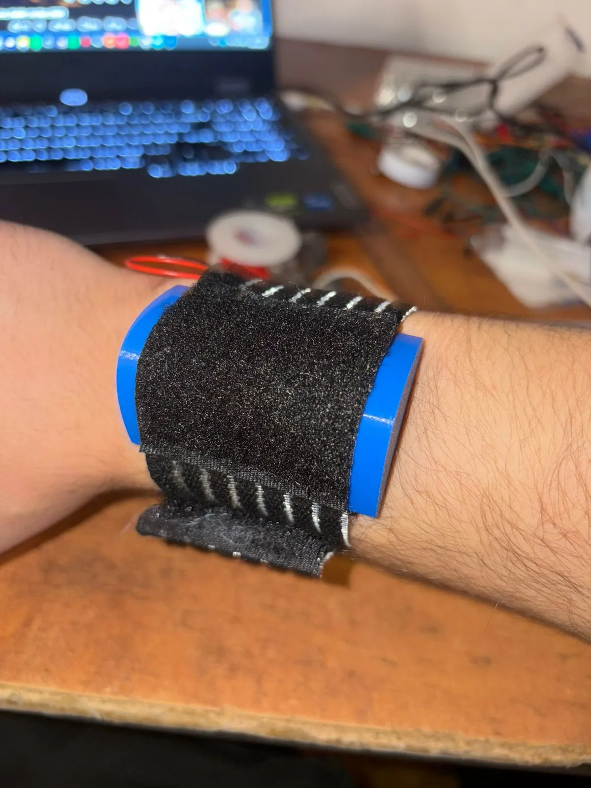 Prototype 3, a black velcro wristband on my wrist